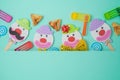 Jewish holiday Purim background with cute paper clowns characters and hamantaschen cookies Royalty Free Stock Photo