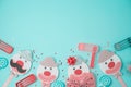 Jewish holiday Purim background with cute paper clowns characters and noisemaker