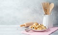 Jewish holiday Purim celebration background with hamantaschen cookies on wooden table. Baking recipe concept