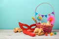 Jewish holiday Purim concept with hamantaschen cookies or hamans ears and mask Royalty Free Stock Photo