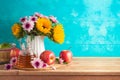 Jewish holiday Rosh Hashana background with honey jar, apple and sunflowers on wooden table Royalty Free Stock Photo