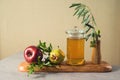 Jewish holiday Rosh Hashana background with honey, pomegranate and red apples. Modern still life composition