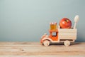 Jewish holiday Rosh Hashana background with toy truck, honey and apples