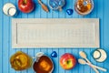 Jewish holiday Rosh Hashana background with wooden board, honey and apples on table. View from above. Royalty Free Stock Photo