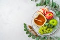 Jewish holiday Rosh Hashana concept with honey, apple and grapes on bright background. Top view, flat lay Royalty Free Stock Photo