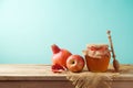 Jewish holiday Rosh Hashanah background with honey jar, apple an Royalty Free Stock Photo