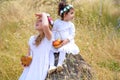 Jewish Holiday Shavuot.Harvest.Two little girls in white dress holds a basket with fresh fruit in a wheat field. Royalty Free Stock Photo