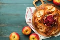 Jewish Holidays - Rosh Hashanah or Rosh Hashana. Pomegranate, apples, honey and round challah on old wooden blue table background