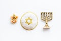 Jewish Kippah Yarmulkes hats with menorah on white table. Top view