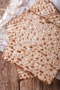 Jewish kosher matzo for Passover macro on a wooden table. vertical top view Royalty Free Stock Photo