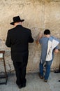 Jewish man and child praying