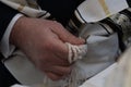 Holding tzitzit around the hand during Jewish prayer