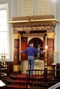 Jewish man opens the Torah ark of Hobart Synagogue Tasmania Australia