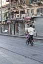 Jewish man riding a bike in the streets of Jerusalem