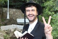 Jewish man showing the peace sign