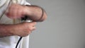 Jewish man wearing hand Tefillin phylacteries