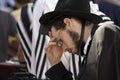 A black clothed jewish man praying at the Wailing wall at Jerusalem Royalty Free Stock Photo