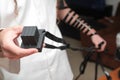 Jewish Man wrapped in tefillin pray . A religious orthodox with arm-tefillin on his left hand prays