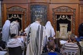 Jewish men wearing prayer shawls