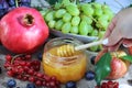 Jewish New Year - Rosh Hashanah, photo for the Jewish holiday. Honey, Apple and Pomegranate - main fruits on Jewish holiday
