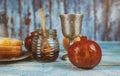 Jewish new year symbol with glass honey jar and fresh ripe apples. Rosh hashanah