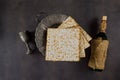 Jewish Passover attributes in composition a cup full of wine and passover matzah Royalty Free Stock Photo