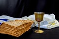 Jewish pesach attributes holiday with cup kosher wine, flatbread matzah at a Passover Royalty Free Stock Photo