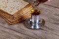 Jewish Pesah celebrating, matzoh and traditional cup kosher wine