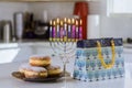Jewish Religion holiday symbol the Chanukah burning candles to hanukkiah Menorah on blurred background