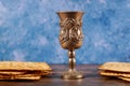 Jewish silver cup with wine with matzos. Passover concept Royalty Free Stock Photo