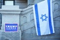 Jewish Star of David Flag next to a Trump poster.