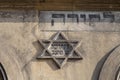 Jewish star of David on the front on old building in Cracow in