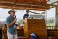 A Jewish Tour Guide in full voice on a timber boat in Galilee