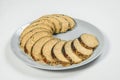 Jewish traditional gefilte fish slices served on Gray serving plate isolated on light background.