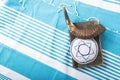 Jewish traditional objects, yarmulke, Tallit, Prayer book shofar -horn on blue jewish prayer shawl. Copy space for text. View