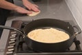 Jewish woman hands preparing traditional Moroccan Moufleta at home