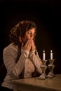 Jewish Woman Prays Over Sabbath Candles Royalty Free Stock Photo