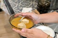 Jewish woman serving Matzah balls soup served on Passover Jewish Holiday Royalty Free Stock Photo
