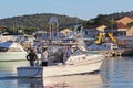 Jezera, Croatia - 9 9 2018: Fishermen on a boat sailing in the waters of the marina. Panorama of a yacht marina in the Dalmatia