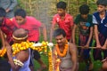 A priest bringing the holy water for the worship of Lord Shiva. the villagers enjoys the programme