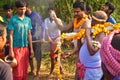 A priest bringing the holy water for the worship of Lord Shiva. the villagers enjoys the programme