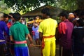 A priest bringing the holy water for the worship of Lord Shiva. the villagers enjoys the programme