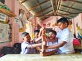 friendly kids in school uniform playing games with smily faces in a local village primary school Royalty Free Stock Photo