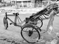 Jhargram, West Bengal, India - May 05, 2019: Black and white image of A empty hand pulled rickshwa on a road of a city in West