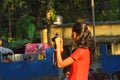 Jhargram, West Bengal, India- October 17,2018: A teenage girl trying to capture photograph with camera