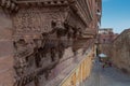 Jharokha, stone window projecting from the wall face of a building, in an upper story, overlooking Mehrangarh fort, Jodhpur,