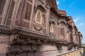 Jharokha, stone window projecting from the wall face of a building, in an upper story, overlooking Mehrangarh fort, Jodhpur,