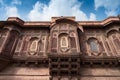 Jharokha, stone window projecting from the wall face of a building, in an upper story, overlooking Mehrangarh fort, Jodhpur,