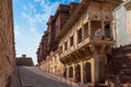 Jharokha, stone window projecting from the wall face of a building, in an upper story, overlooking Mehrangarh fort, Jodhpur,