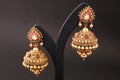 jhumki. golden earrings for women with white and green red diamonds traditional wedding wear for women,